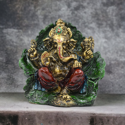 LORD GANESH JI SITTING ON LEAF MURTI (17 CM HEIGHT)